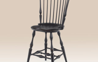Historical Fan Back Windsor Stool in antique black over red crackle finish.