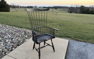 Philadelphia Comb Back Windsor Chair with carved ears and shaped seat.