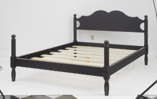 Black Queen Size Cannonball Bed in antique black over red crackle finish.