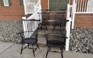 Set of six Historical Windsor Chairs in antique black over red crackle finish.