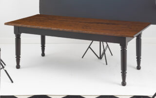 7ft Gettysburg Farmhouse Table with hand-planed cherry wood top and antique black over red painted base.