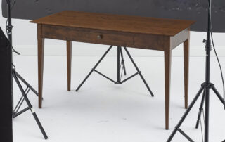 Cherry Wood Desk with a dovetailed drawer, tapered legs, and a tapered top, perfect for country cottage or modern home décor.