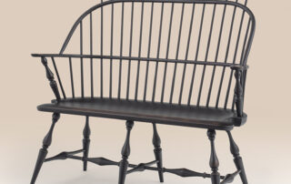 Connecticut Windsor Settee with comb design and Antique Black over Red Crackle finish.