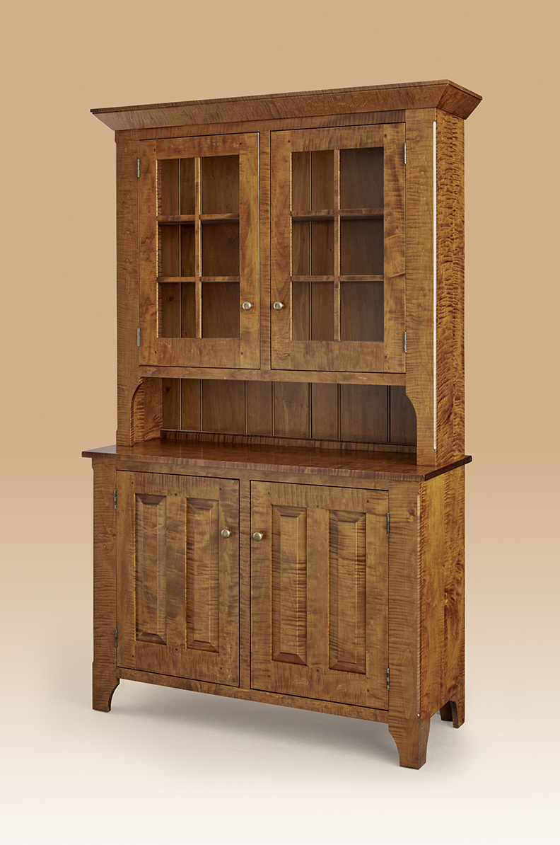 Wooden hutch with glass doors, blending storage and style for farmhouse furniture decor.