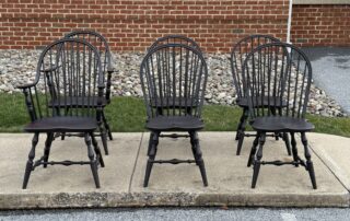 Pennsylvania Made Six Windsor Chairs with Continuous Arm and Bow Back designs in Antique Black over Red Finish.