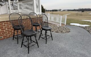 Set of 4 Swivel Windsor Stools with bow backs and an antique black over red crackle finish. Classic counter-height seating.