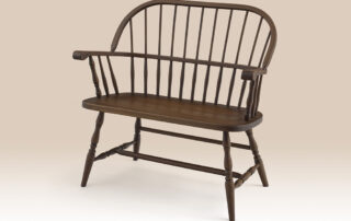 Cherry Small Windsor Bench with a sack back design, turned legs, and a Pennsylvania Russet finish. Crafted in Pennsylvania.