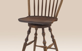 Cherry Swivel Bow Back Windsor Stool with turned legs, a swivel seat, and a Pennsylvania Russet finish. Available in counter and bar height.