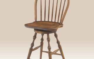 Maple Swivel Bow Back Windsor Stool with turned legs, swivel seat, and a Pennsylvania Ginger finish. Available in counter and bar heights.