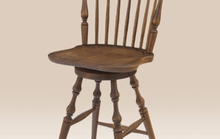 Maple Swivel Fan Back Windsor Stool with turned legs, swivel seat, and a Pennsylvania Ginger finish. Available in counter and bar heights.