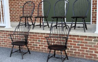 Set of 6 New Windsor Chairs with sack back and bow back design in Antique Black over Red Crackle finish. Made in Pennsylvania.