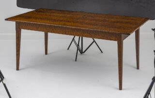 6ft x 38in Tiger Maple Wood Table with a light hand-planed top, breadboard ends, and chamfered legs. Made in Pennsylvania.