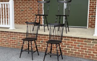 Four Fan Back Stools with Windsor-style design, turned legs, and mortised seats. Finished in Antique Black over Red.