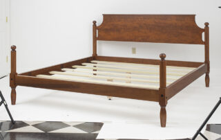 King Size Pennsylvania Cannonball Bed with turned posts and simple headboard. Shown in tiger maple wood. Made in the USA.