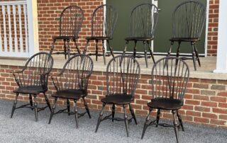 Set of 8 Windsor Chairs with brace backs, including arm and side chairs.