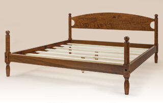 American Made Tiger Maple Cannonball Bed with acorn motif and low poster design.