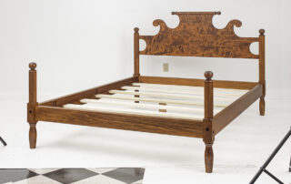 Tiger Maple Queen Size Cannonball Bed with cannonball posts and rolling pin headboard. Made in the USA.