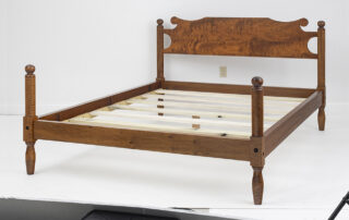 Queen Size South Carolina Low Poster Bed with cannonball posts and a shaped headboard.
