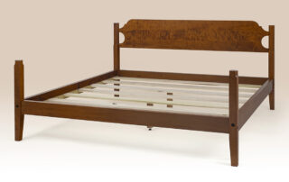 Historical Osterville Low Post Bed in tiger maple with Shaker-style posts and shaped headboard.