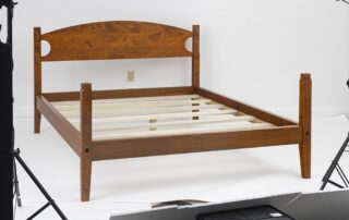 Queen Size Shaker Bed in tiger maple with low poster design and simple headboard.