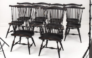Set of 10 Historical Fan Back Windsor Chairs with antique black over red crackle finish.