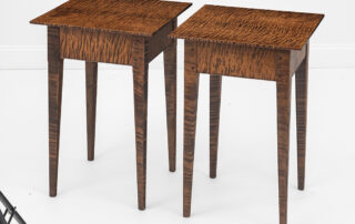 Pair of tiger maple wood stands with tapered legs and pegged joinery.