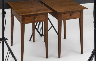 Pair of cherry wood country stands with tapered legs and dovetailed drawers.