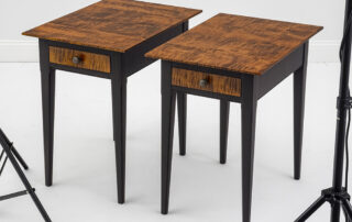 Pair of country stands with tapered legs and tiger maple tops.
