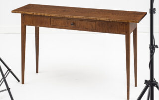 Shaker-style tiger maple hall table with dovetailed drawer.