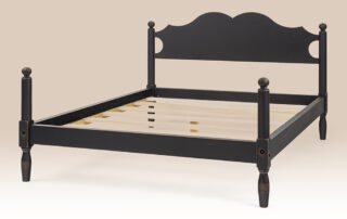 Keswick cannonball bed with low posts and shaped headboard in antique black.