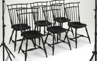 Set of six Windsor side chairs with bamboo style turnings in antique black over red.