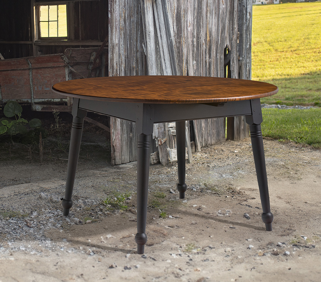 Farmhouse table with tiger maple top and painted base featuring turned legs, suited for dining rooms and kitchens.