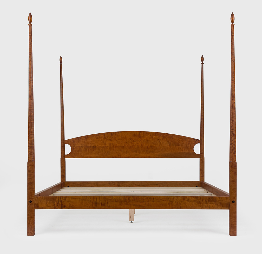 Pencil post bed with wood frame and balanced proportions, ideal for period homes or adding structure to a bedroom space.